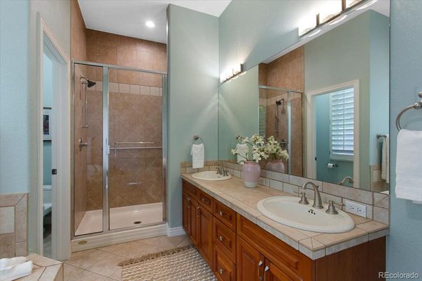 Bathroom, Dual Sink Vanities, Glass Shower, Interior, Recessed Lighting, Tile Countertops