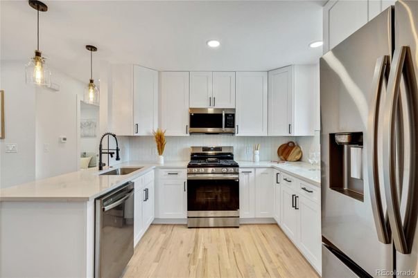 Interior, Kitchen, Pendant Lights, Recessed Lighting, Stainless Steel Appliances, Wood Texture Flooring