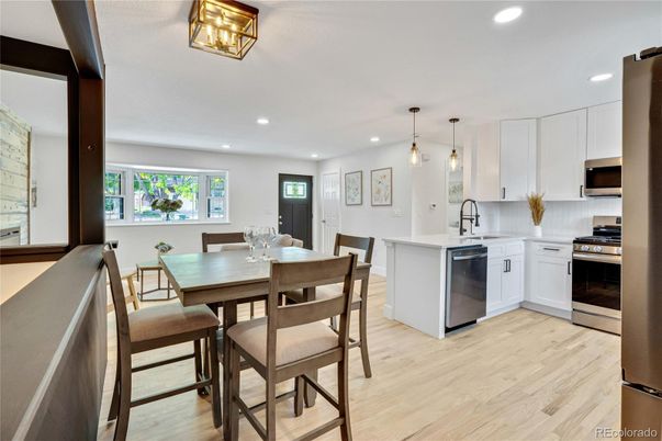 Dining room, Interior, Kitchen, Pendant Lights, Recessed Lighting, Stainless Steel Appliances, Wood Texture Flooring