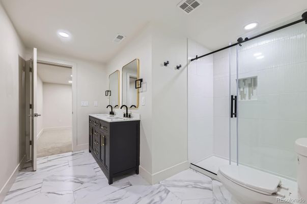 Bathroom, Dual Sink Vanities, Glass Shower, Interior, Marble, Recessed Lighting