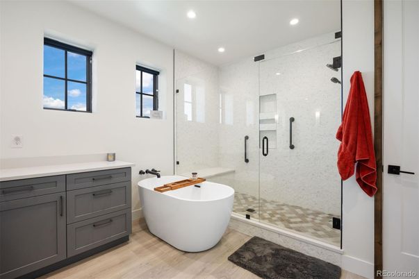 Bathroom, Free Standing Baths, Glass Shower, Interior, Recessed Lighting, Wood Texture Flooring