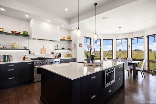 Dining room, Interior, Kitchen, Pendant Lights, Recessed Lighting, Stainless Steel Appliances, Wood Texture Flooring