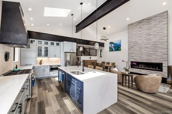 Dining room, Fireplace, Interior, Kitchen, Pendant Lights, Recessed Lighting, Stainless Steel Appliances, Wood Texture Flooring