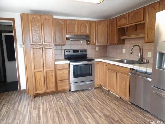 Interior, Kitchen, Stainless Steel Appliances, Tile Countertops, Wood Texture Flooring