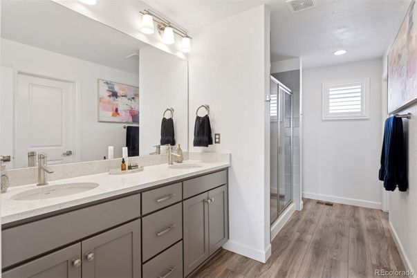 Bathroom, Dual Sink Vanities, Glass Shower, Interior, Recessed Lighting, Wood Texture Flooring