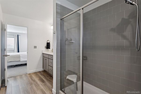 Bathroom, Bedroom, Glass Shower, Interior, Recessed Lighting, Wood Texture Flooring