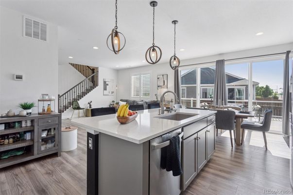 Dining room, Interior, Kitchen, Pendant Lights, Recessed Lighting, Stainless Steel Appliances, Wood Texture Flooring