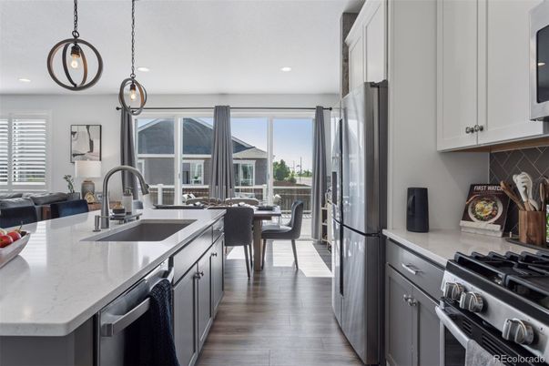 Dining room, Interior, Kitchen, Pendant Lights, Recessed Lighting, Stainless Steel Appliances, Wood Texture Flooring