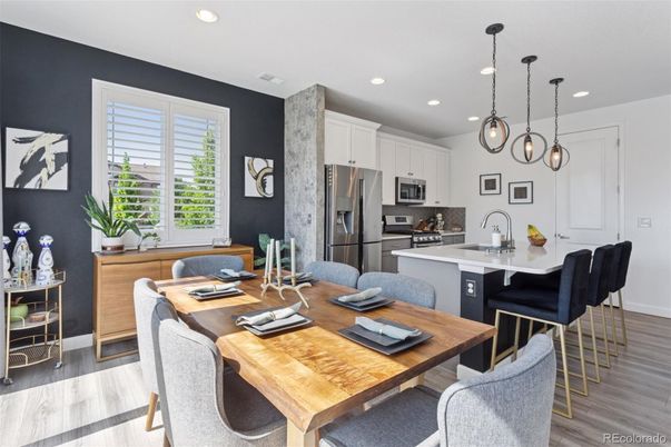 Dining room, Interior, Kitchen, Pendant Lights, Recessed Lighting, Stainless Steel Appliances, Wood Texture Flooring