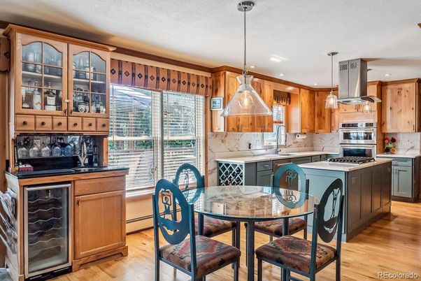 Dining room, Interior, Kitchen, Pendant Lights, Recessed Lighting, Stainless Steel Appliances, Wood Texture Flooring