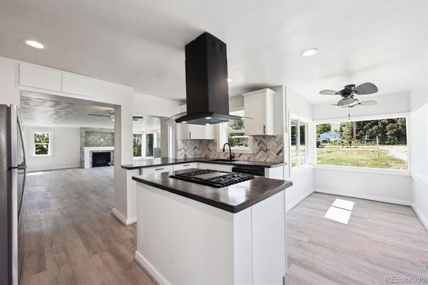 Fireplace, Interior, Kitchen, Recessed Lighting, Wood Texture Flooring
