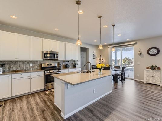 Dining room, Interior, Kitchen, Pendant Lights, Recessed Lighting, Stainless Steel Appliances, Wood Texture Flooring