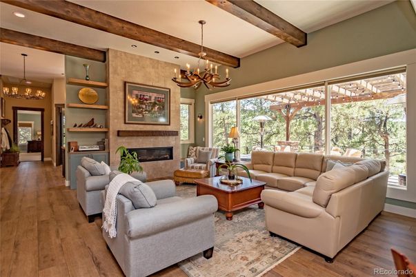 Chandelier, Fireplace, Interior, Living room, Pendant Lights, Recessed Lighting, Wooden Beams, Wood Texture Flooring