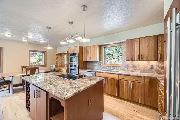 Dining room, Interior, Kitchen, Pendant Lights, Stainless Steel Appliances, Wood Texture Flooring