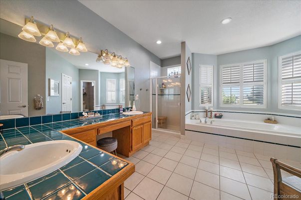 Bathroom, Dual Sink Vanities, Glass Shower, Interior, Recessed Lighting, Tile Countertops