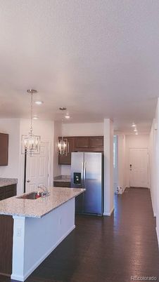 Chandelier, Interior, Kitchen, Pendant Lights, Recessed Lighting, Stainless Steel Appliances, Wood Texture Flooring