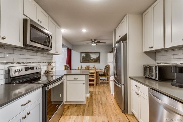 Dining room, Interior, Kitchen, Recessed Lighting, Stainless Steel Appliances, Wood Texture Flooring