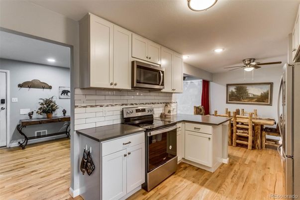 Dining room, Interior, Kitchen, Recessed Lighting, Stainless Steel Appliances, Wood Texture Flooring