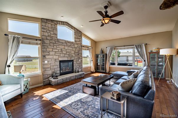 Fireplace, Interior, Living room, Recessed Lighting, Stone Walls, Wood Texture Flooring