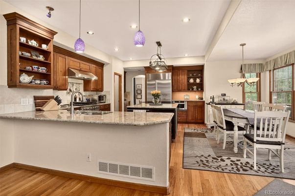 Dining room, Interior, Kitchen, Pendant Lights, Recessed Lighting, Stainless Steel Appliances, Wood Texture Flooring