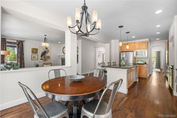 Chandelier, Dining room, Interior, Kitchen, Pendant Lights, Recessed Lighting, Stainless Steel Appliances, Wood Texture Flooring