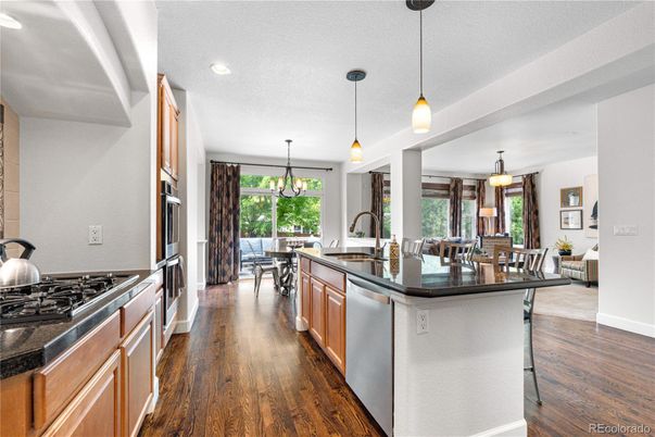 Dining room, Interior, Kitchen, Pendant Lights, Recessed Lighting, Stainless Steel Appliances, Wood Texture Flooring