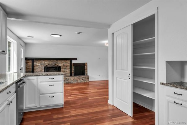 Fireplace, Interior, Kitchen, Recessed Lighting, Stone Walls, Wood Texture Flooring