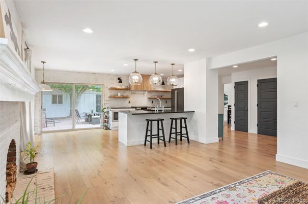 Dining room, Fireplace, Interior, Kitchen, Pendant Lights, Recessed Lighting, Stainless Steel Appliances, Wood Texture Flooring