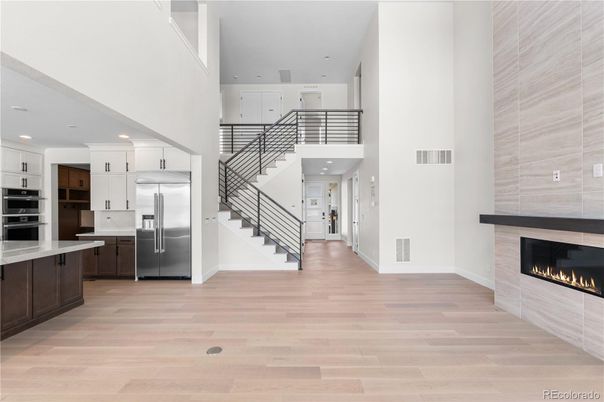 Fireplace, Interior, Kitchen, Recessed Lighting, Stainless Steel Appliances, Wood Texture Flooring