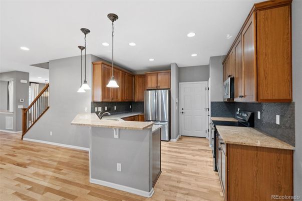 Interior, Kitchen, Pendant Lights, Recessed Lighting, Stainless Steel Appliances, Wood Texture Flooring