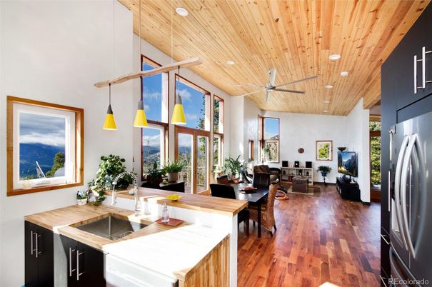 Dining room, Interior, Kitchen, Living room, Pendant Lights, Recessed Lighting, Stainless Steel Appliances, Wooden Ceilings, Wood Texture Flooring