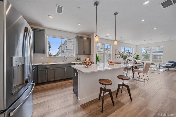Dining room, Interior, Kitchen, Pendant Lights, Recessed Lighting, Stainless Steel Appliances, Wood Texture Flooring