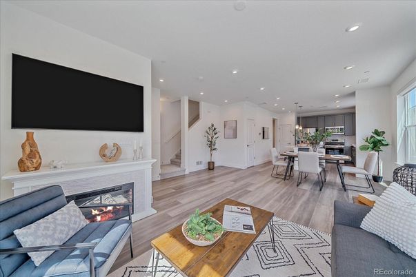 Dining room, Fireplace, Interior, Kitchen, Living room, Recessed Lighting, Stainless Steel Appliances, Wood Texture Flooring