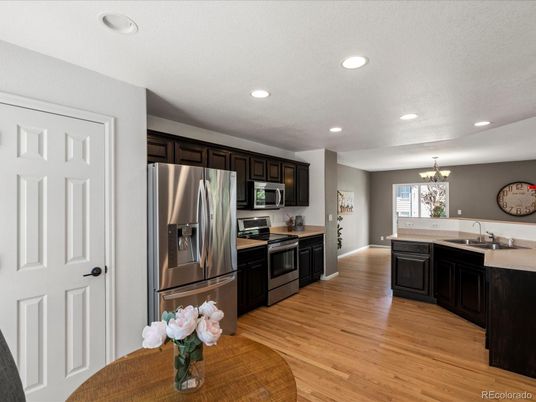 Chandelier, Interior, Kitchen, Recessed Lighting, Stainless Steel Appliances, Wood Texture Flooring