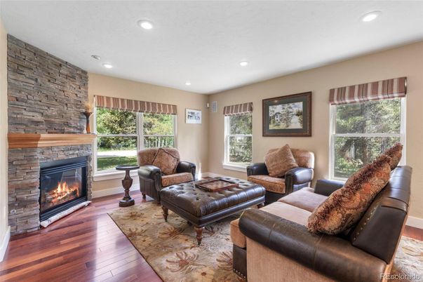 Fireplace, Interior, Living room, Recessed Lighting, Stone Walls, Wood Texture Flooring