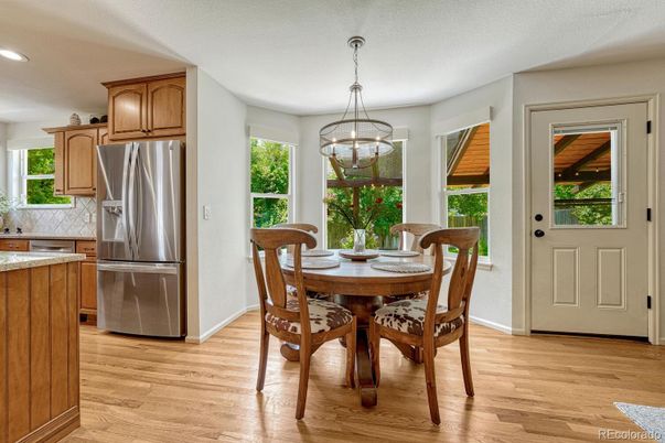 Dining room, Interior, Kitchen, Pendant Lights, Recessed Lighting, Stainless Steel Appliances, Wood Texture Flooring