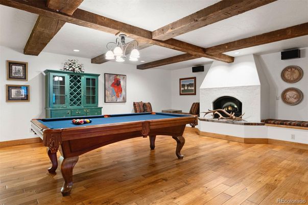 Billiard Table, Chandelier, Fireplace, Game Room, Interior, Recessed Lighting, Wooden Beams, Wood Texture Flooring