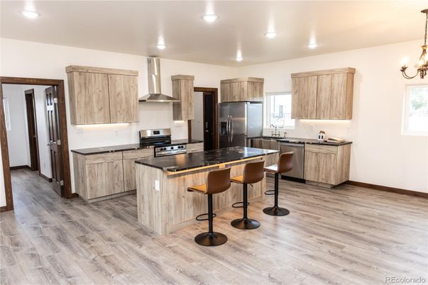 Chandelier, Interior, Kitchen, Recessed Lighting, Stainless Steel Appliances, Wood Texture Flooring