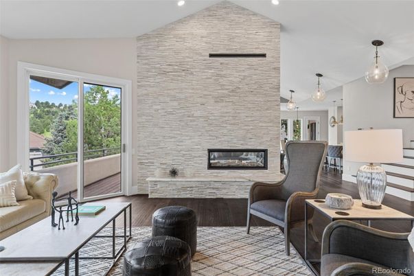 Fireplace, Interior, Living room, Pendant Lights, Recessed Lighting, Stone Walls, Wood Texture Flooring