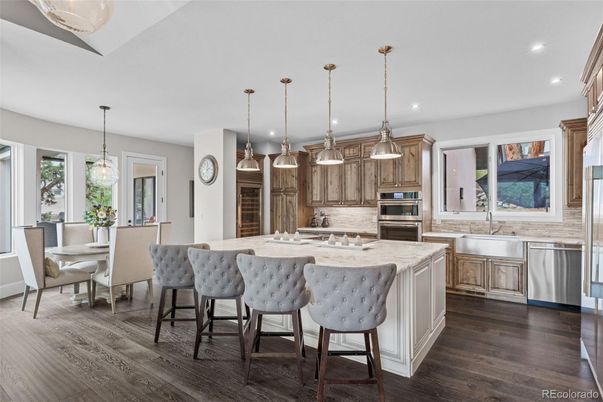 Dining room, Interior, Kitchen, Pendant Lights, Recessed Lighting, Stainless Steel Appliances, Wood Texture Flooring