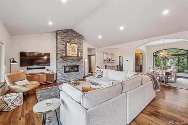 Chandelier, Dining room, Fireplace, Interior, Living room, Recessed Lighting, Stone Walls, Wood Texture Flooring