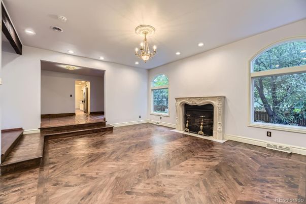Chandelier, Empty room, Fireplace, Interior, Recessed Lighting, Wood Texture Flooring