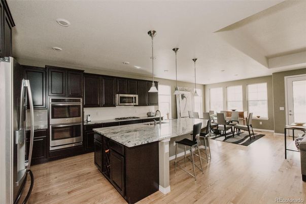 Dining room, Interior, Kitchen, Pendant Lights, Recessed Lighting, Stainless Steel Appliances, Wood Texture Flooring