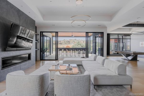 Billiard Table, Fireplace, Interior, Living room, Pendant Lights, Recessed Lighting, Wood Texture Flooring