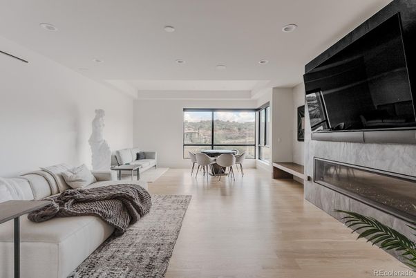 Dining room, Fireplace, Interior, Living room, Recessed Lighting, Wood Texture Flooring