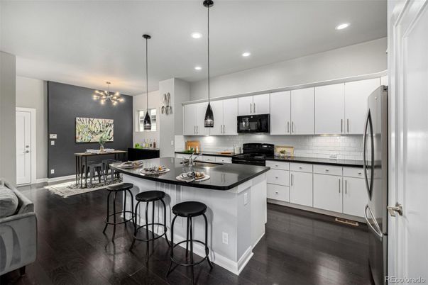 Dining room, Interior, Kitchen, Pendant Lights, Recessed Lighting, Stainless Steel Appliances, Wood Texture Flooring