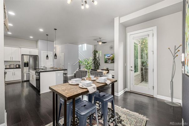 Dining room, Interior, Kitchen, Pendant Lights, Recessed Lighting, Stainless Steel Appliances, Wood Texture Flooring