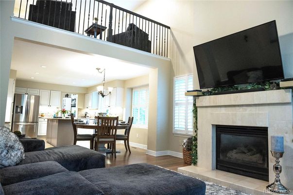 Chandelier, Dining room, Fireplace, Interior, Kitchen, Living room, Recessed Lighting, Stainless Steel Appliances, Wood Texture Flooring