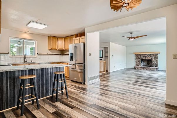 Fireplace, Interior, Kitchen, Tile Countertops, Wood Texture Flooring