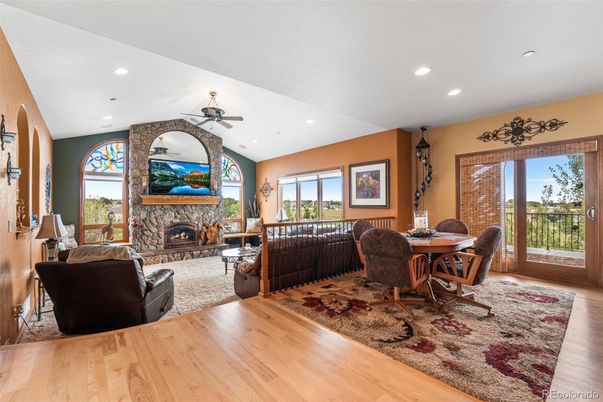Dining room, Fireplace, Interior, Living room, Recessed Lighting, Wood Texture Flooring